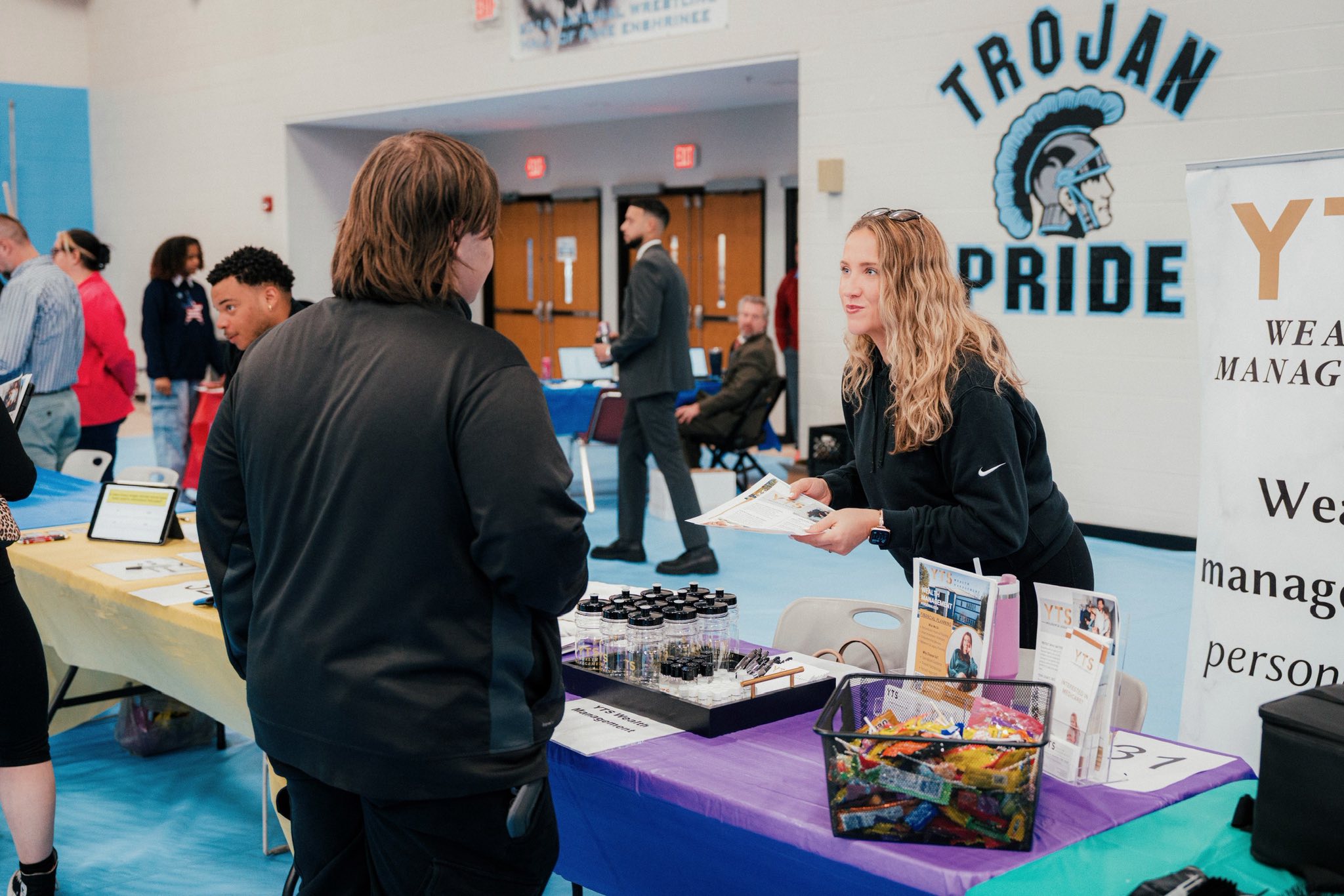 photo of students at the Johnstown High School Job Fair speaking with a YTS representative