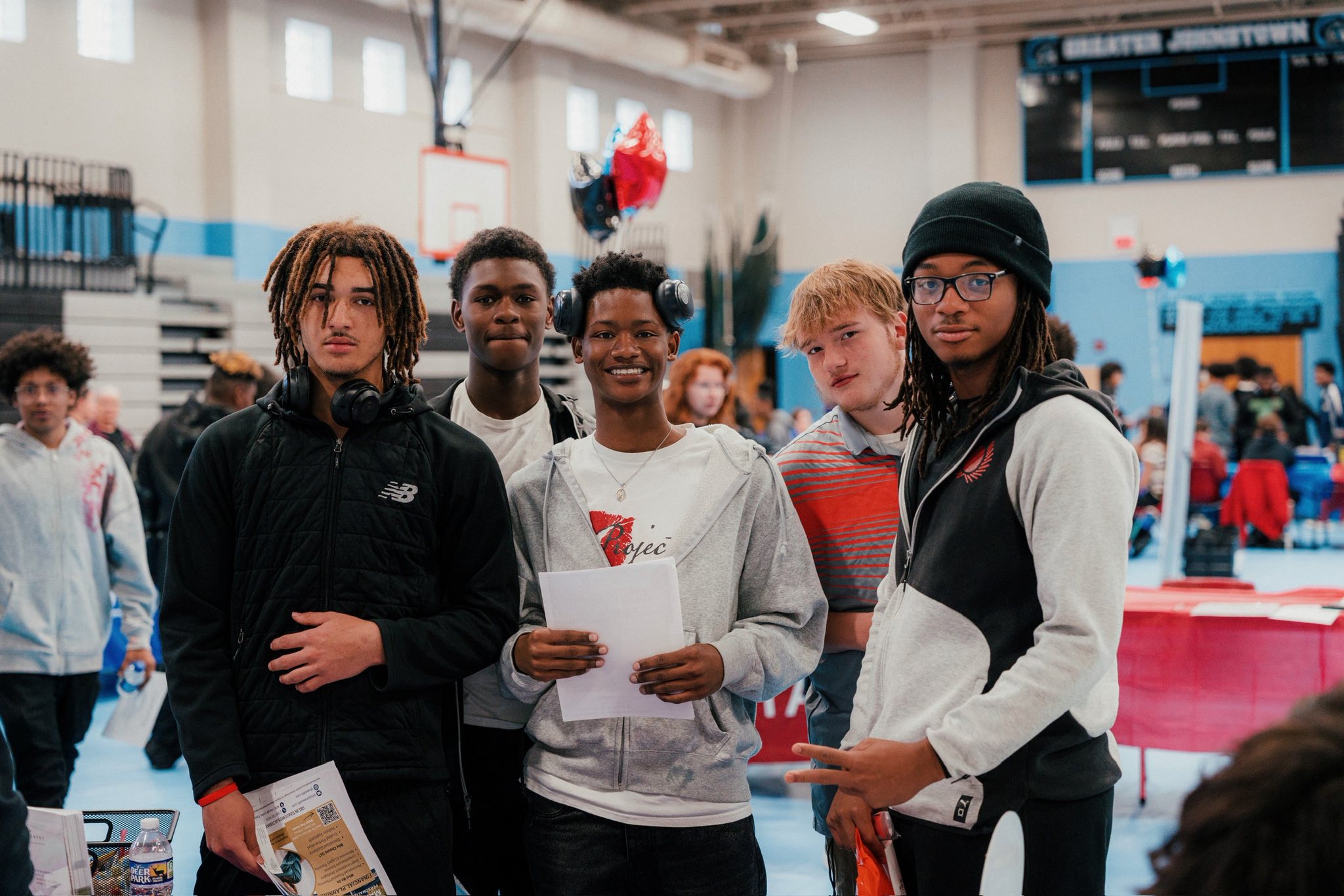photo of students at the Johnstown High School Job Fair holding YTS brochures