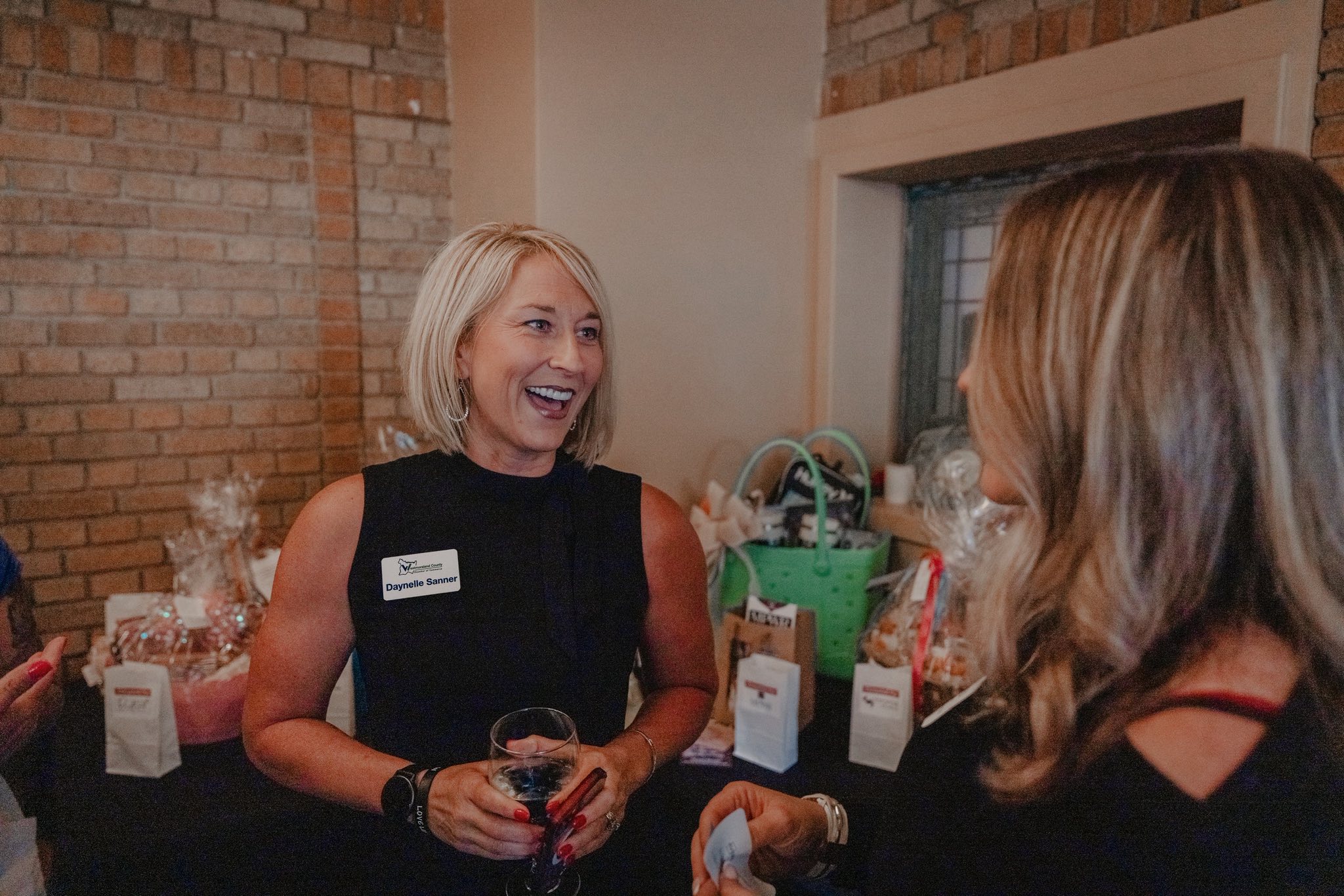 two women chatting at the Women of Westmoreland networking event
