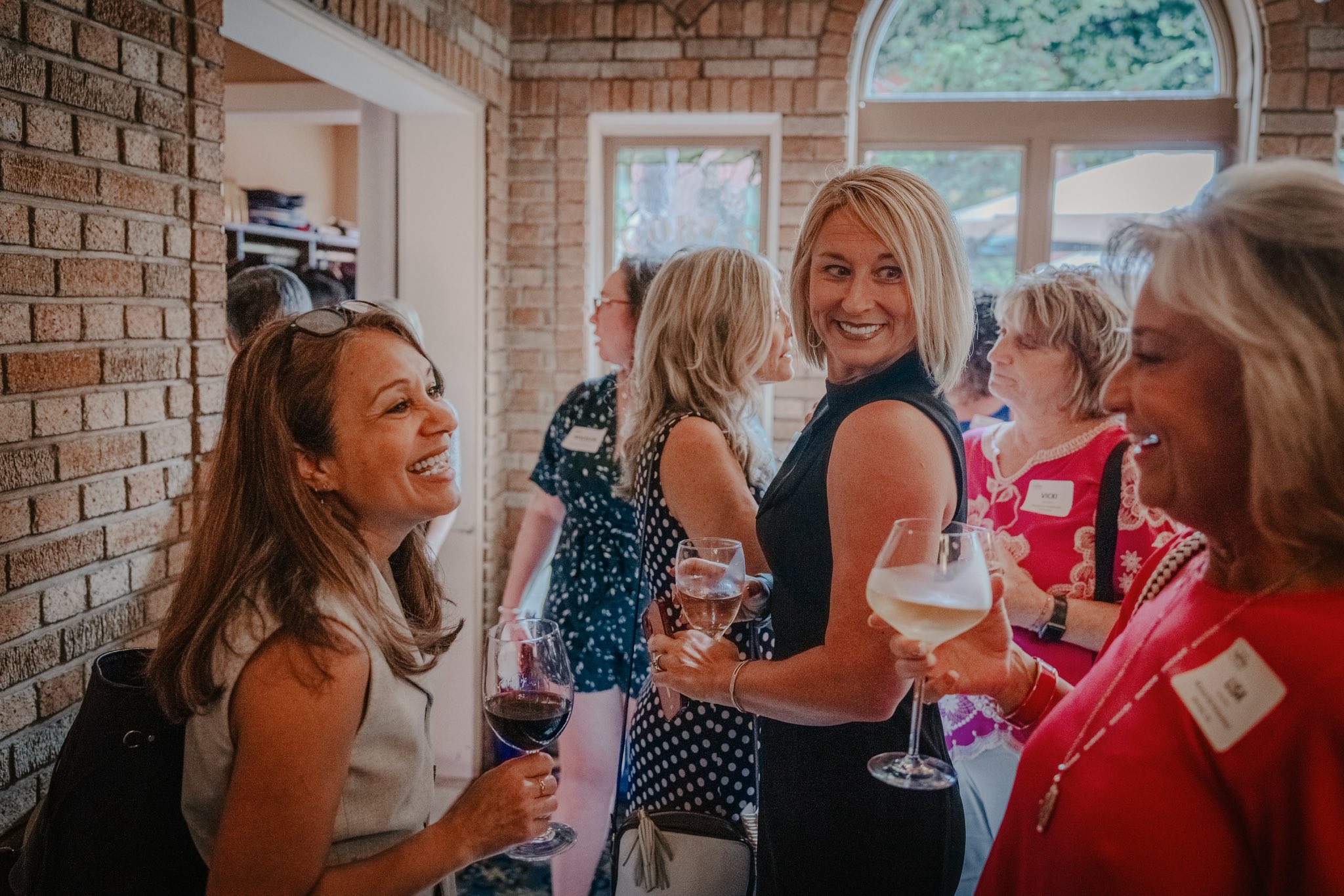 photo of a group of several women talking at the Women of Westmoreland networking event