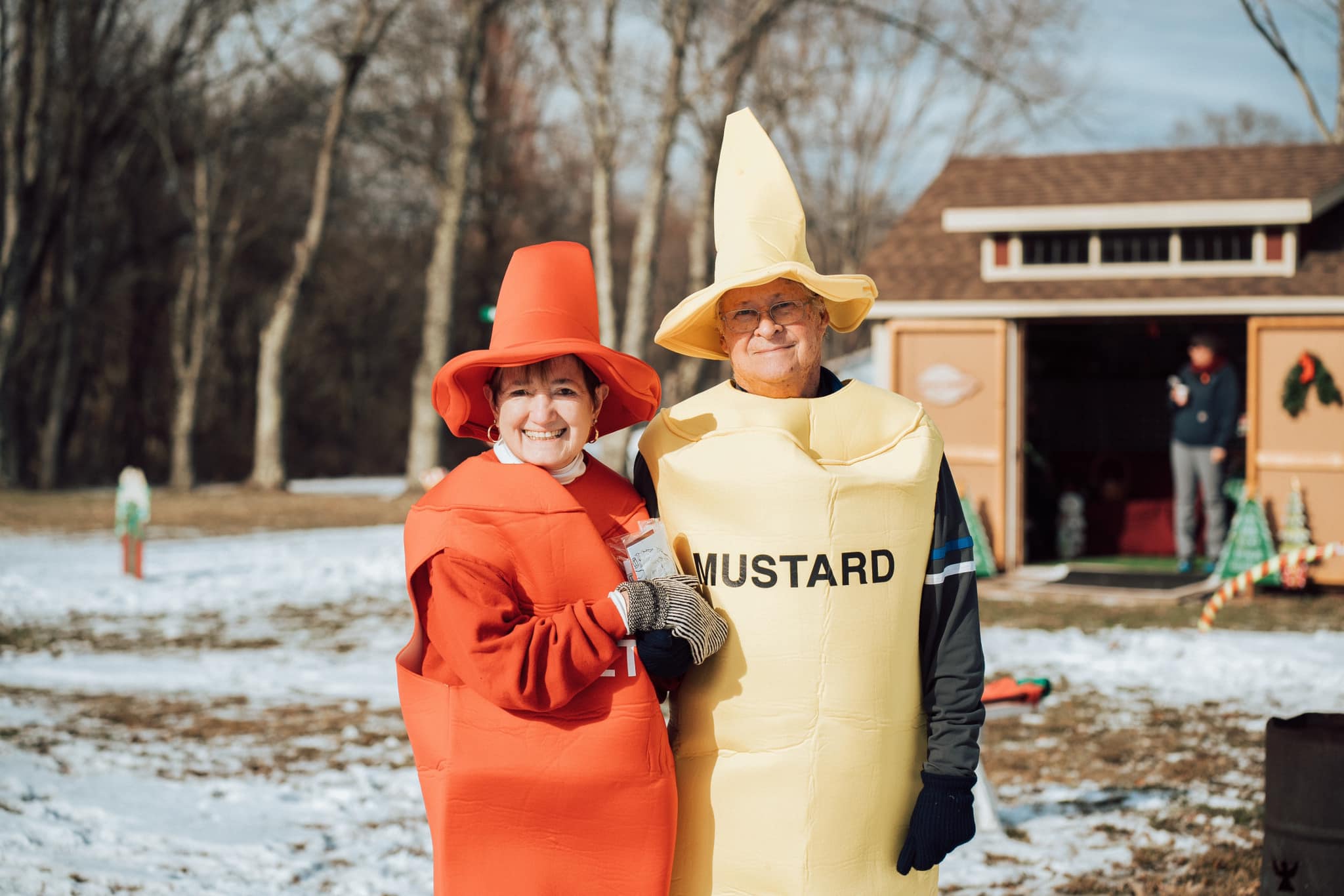 a couple dressed up as ketchup and mustard at the Santa at Sardis holiday event