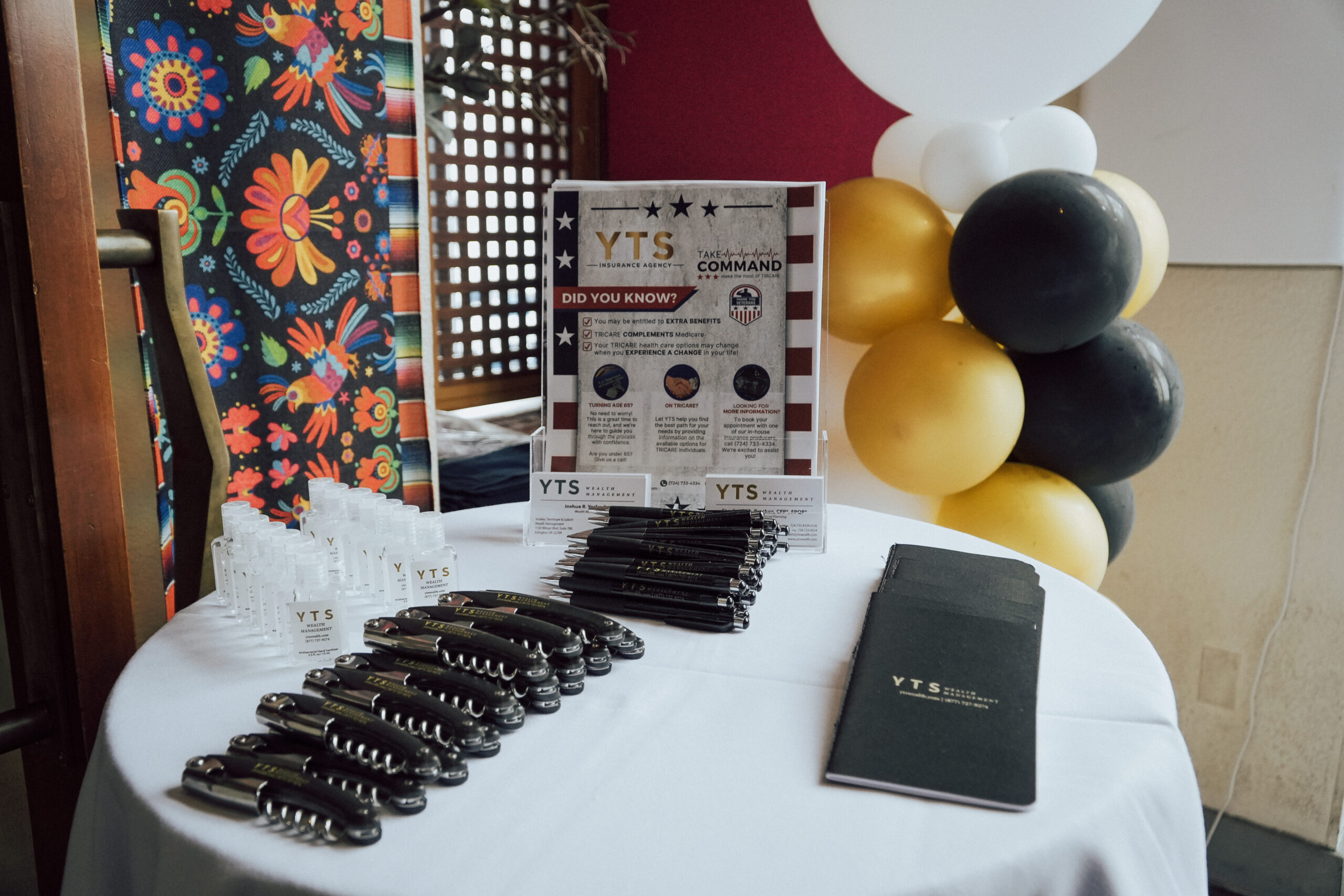 table with giveaways at the Arlington Client Appreciation Happy Hour
