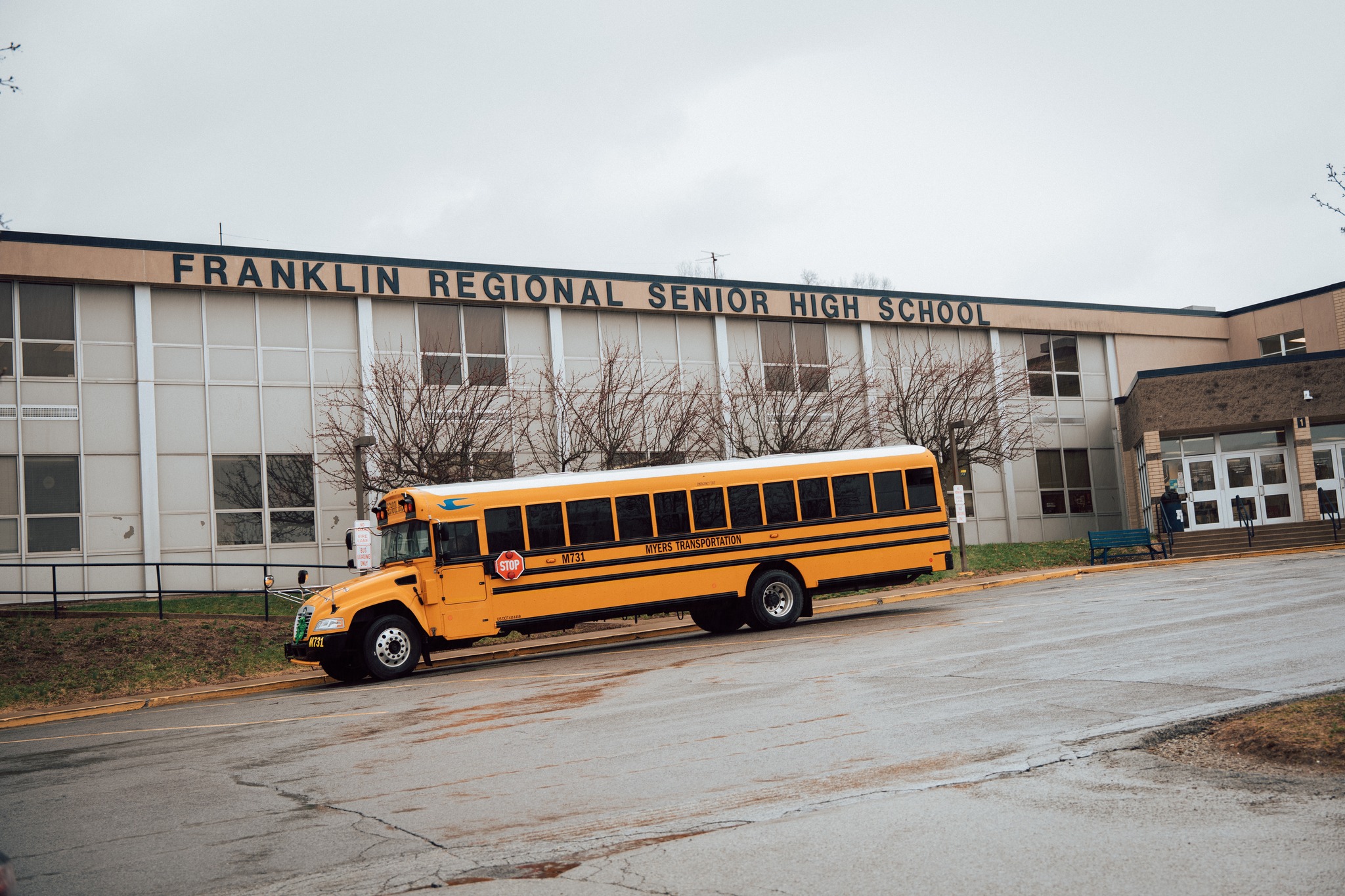 school bus parked outside of Franklin Regional High School